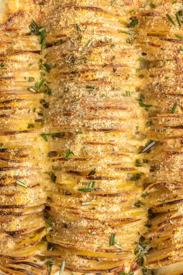 garlic and herb scalloped potatoes, easter dinner ideas, sliced and arranged in a casserole dish