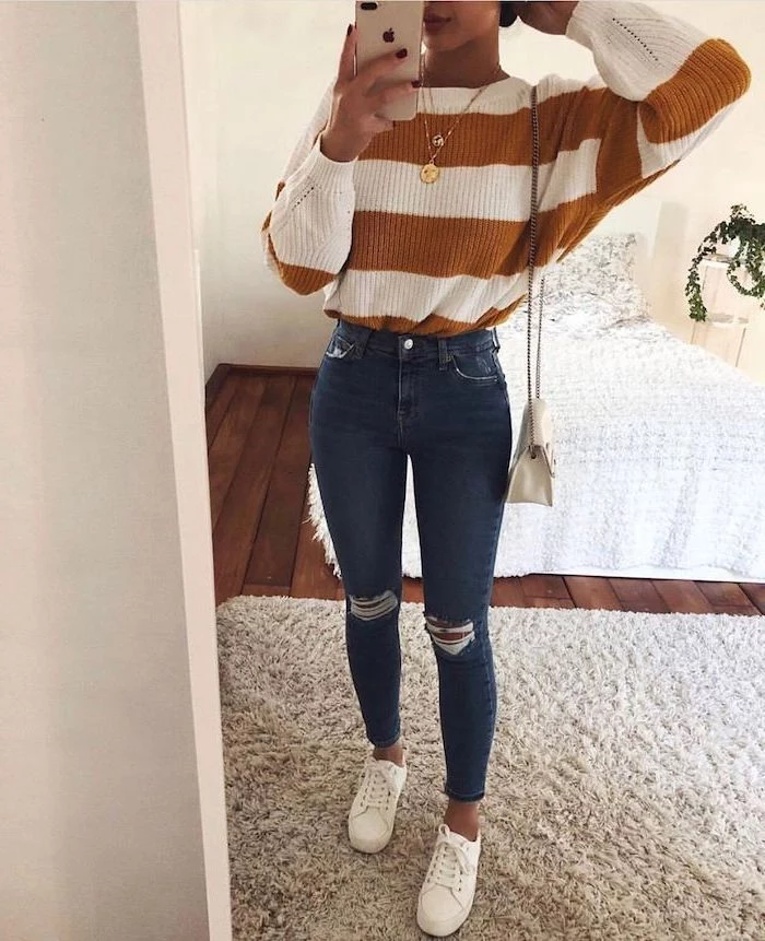 white sneakers, cute back to school outfits, woman wearing jeans, white and brown striped sweater