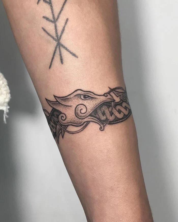 forearm tattoo, dragon wrapped around the arm, ouroboros tattoo, white background