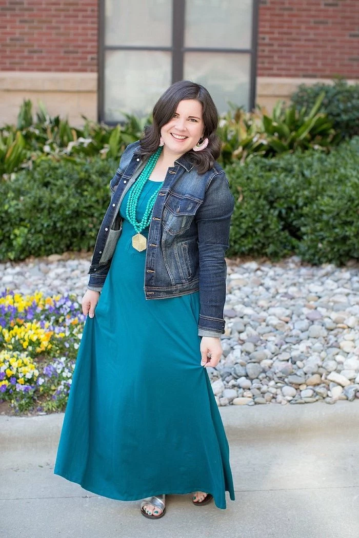 woma with short black hair, wearing long turquoise dress, easter outfit, denim jacket on top