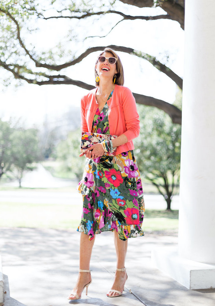 woman with short bob, wearing a dress with floral print, pink cardigan, easter outfits women, nude sandals