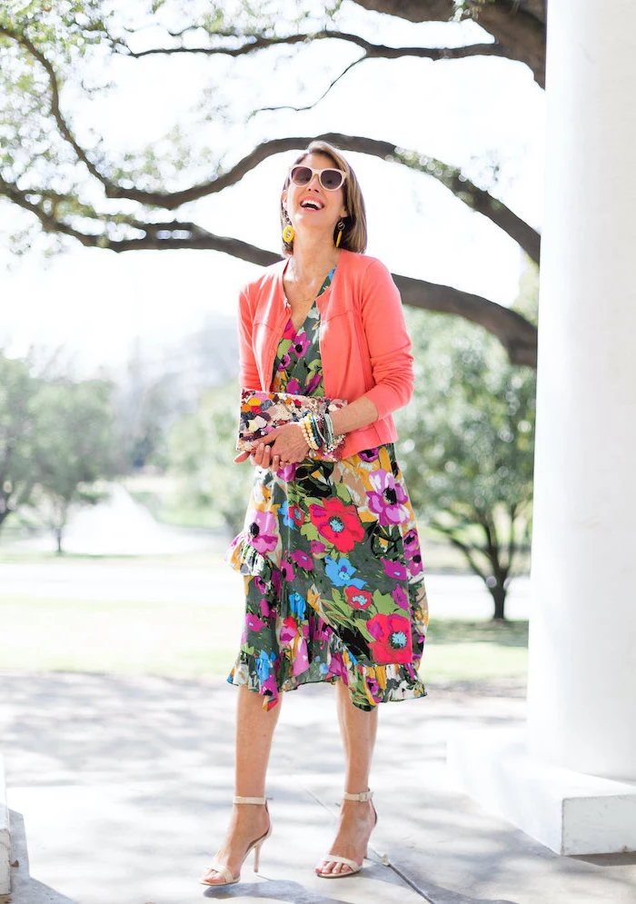 woman with short bob, wearing a dress with floral print, pink cardigan, easter outfits women, nude sandals