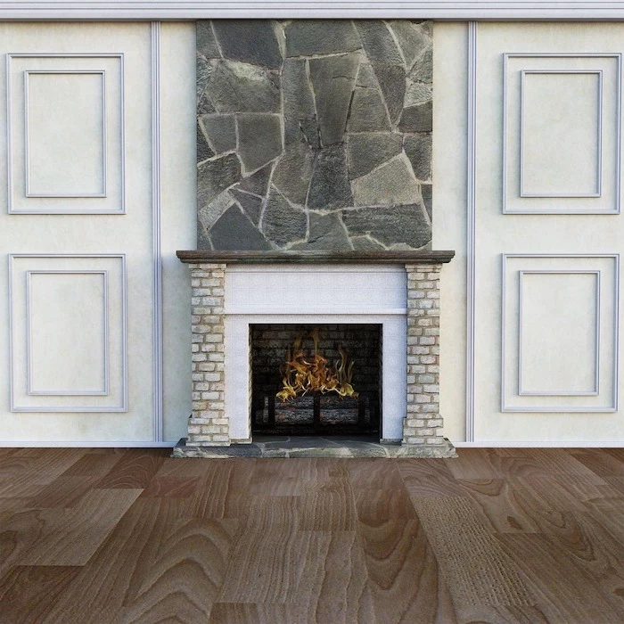 fireplace with fire burning inside, laminate flooring, wooden floor and white walls