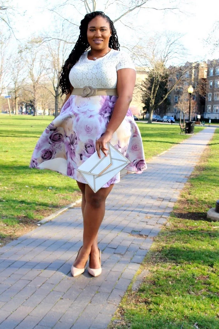 woman with black braided hair, wearing a white lace top, skirt with floral print, plus size easter dresses