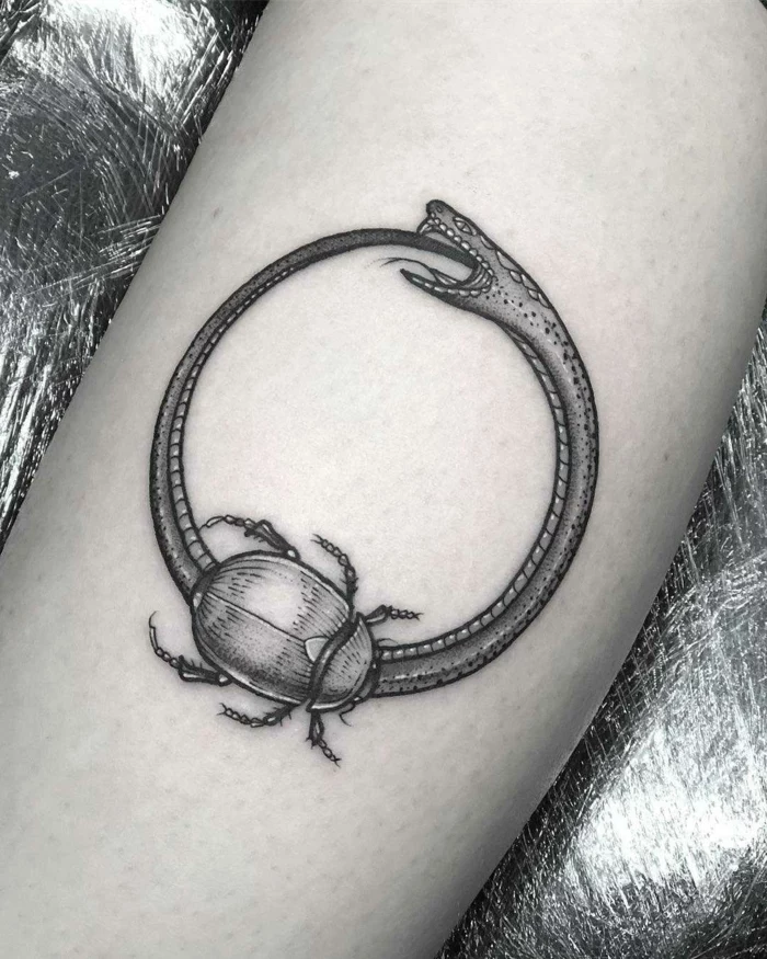 snake eating itself, scarab and a snake, forearm tattoo, black and white photo