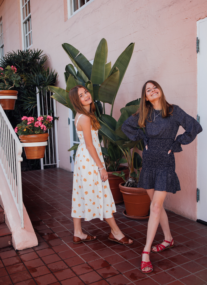 two girls with blonde hair, wearing two different dresses, plus size easter dresses, flat sandals