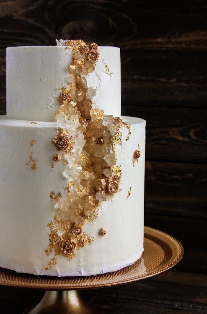 rock candy cake, two tier cake, covered with white fondant, decorated with white and gold rock candy and roses