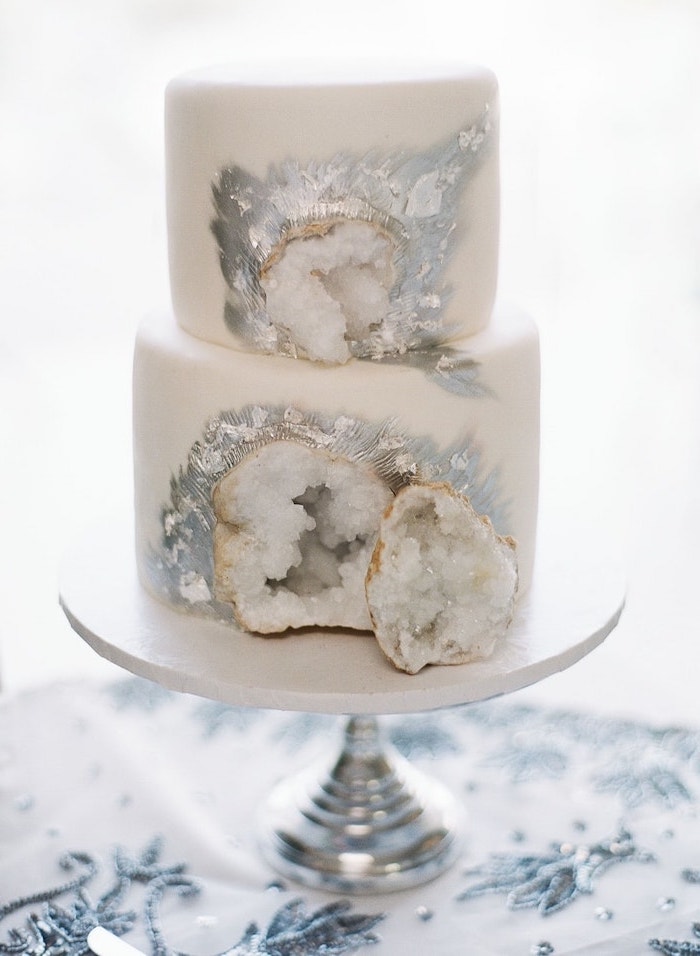 two tier cake, covered with white fondant, amethyst cake, decorated with white rock candy and silver paint