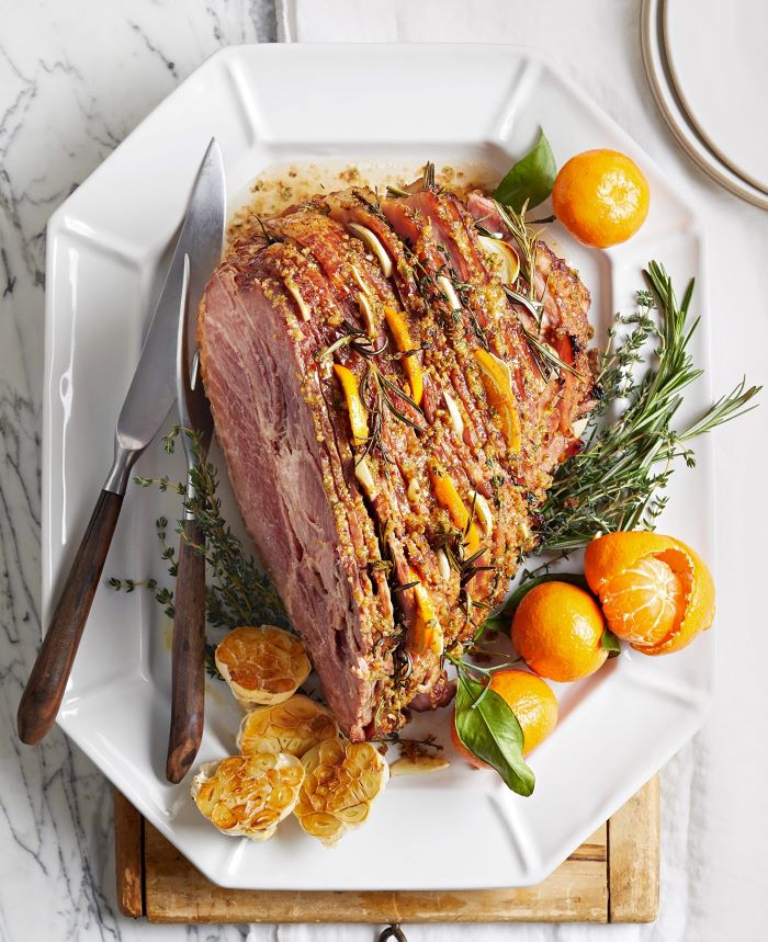 sliced ham with tangerine slices in between, easter menu ideas 2019, tangerines on the side of white plate