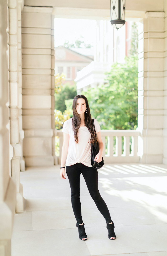 brunette girl wearing black trousers, white t shirt, black open toes boots, cute outfits for kids