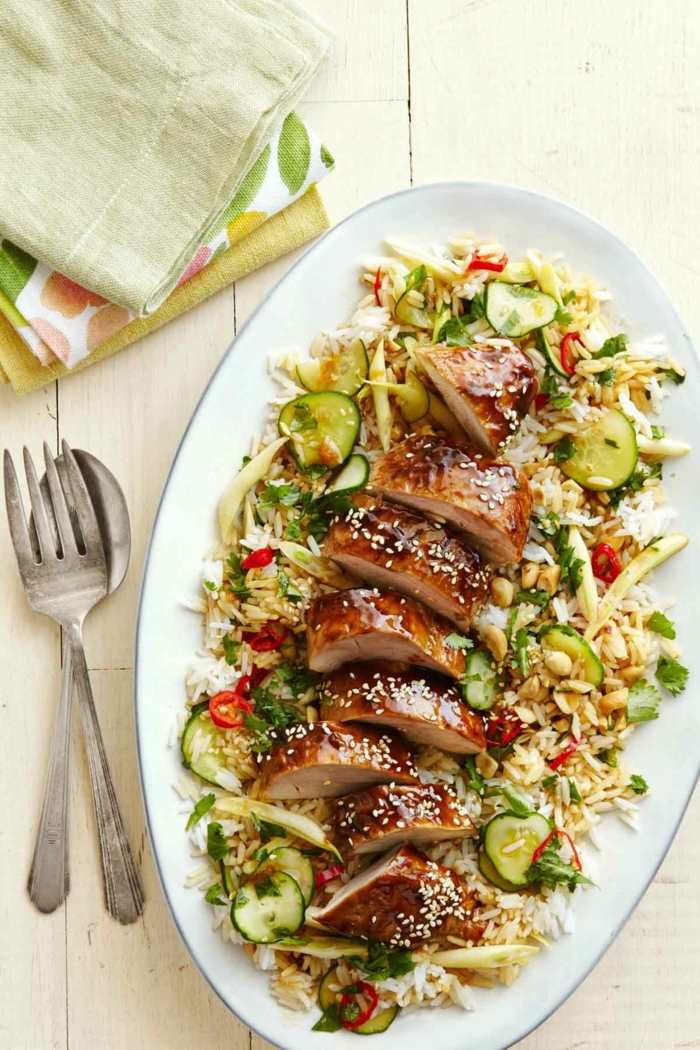 hoisin glazed pork tendeloin, asian rice salad, garnished with sesame seeds, quick and easy dinner recipes