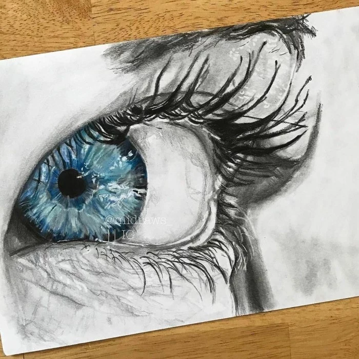 drawing of an icy blue eye with long lashes, how to draw eyes easy, drawn on white backgorund