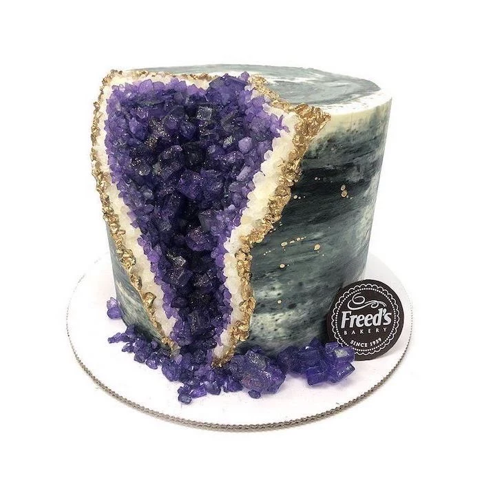 one tier cake, covered with grey and white marble fondant, decorated with purple rock candy, geode cake recipe