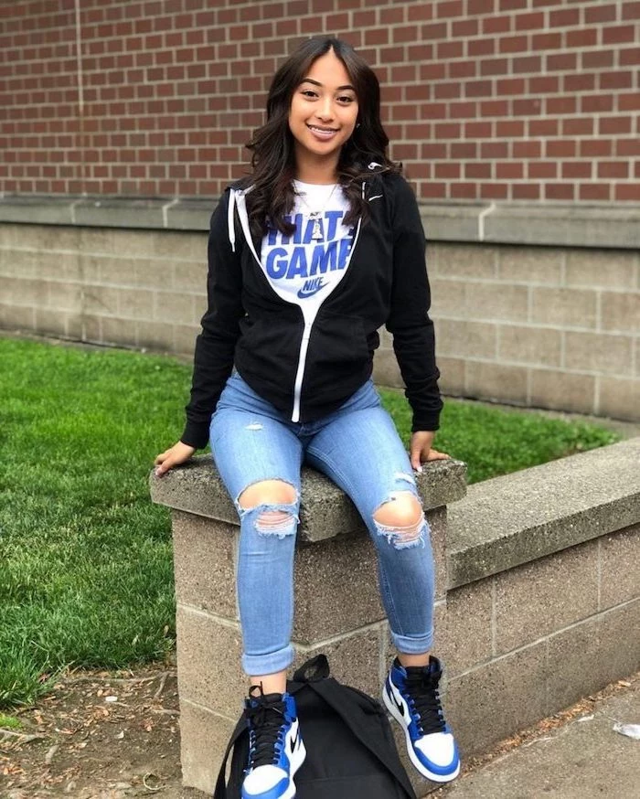 girl wearing jeans, white nike t shirt, black nike hoodie, middle school outfits, white blue and black nike air sneakers