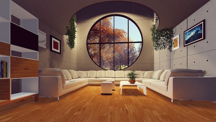 large-living-room-with-round-window-large-white-sofa-laminate-flooring-white-coffee-table-ottomans large living room with large white sofa, laminate flooring, wooden floor and large round window, white coffee table and ottomans