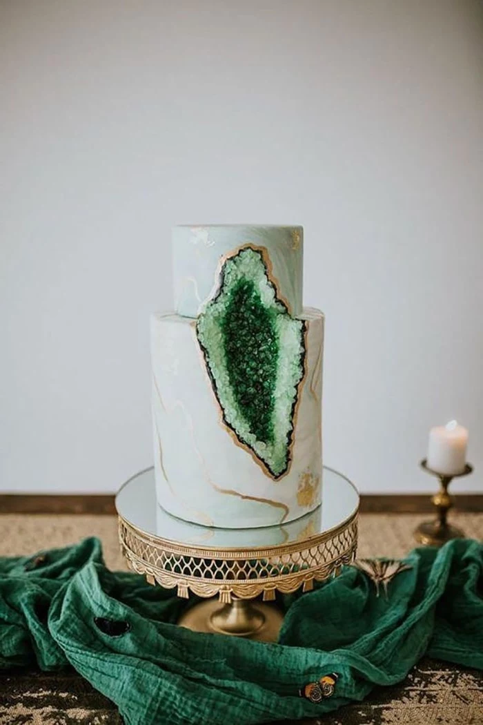 two tier cake, covered with white and green marble fondant, geode cake recipe, decorated with green rock candy