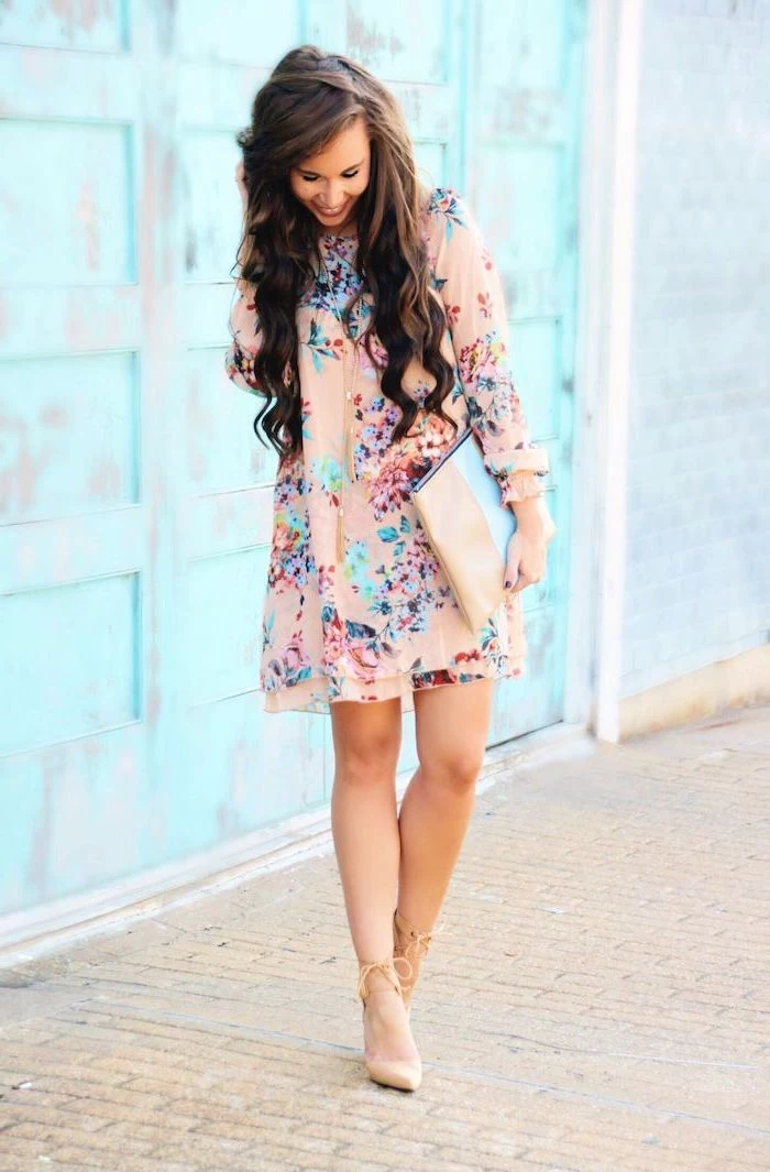 woman with long wavy brown hair, easter dresses 2019, wearing a pink dress with floral print, nude heels
