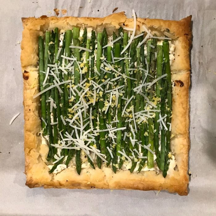 puff pastry with asparagus and cheese inside, easter dinner ideas 2019, placed on white baking paper