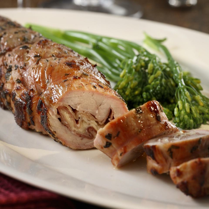 pieces of tender baked meat, stuffed wtih ham and cheese, easter dinner ideas no ham, placed on white plate