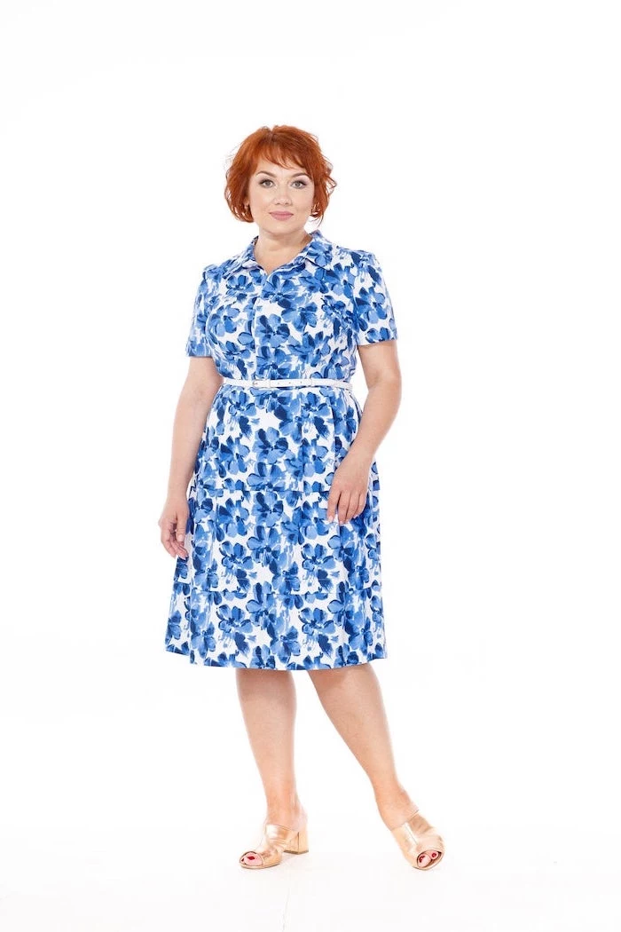 woman with short red hair, wearing a white dress with blue floral print, womens easter dresses 2019, white background