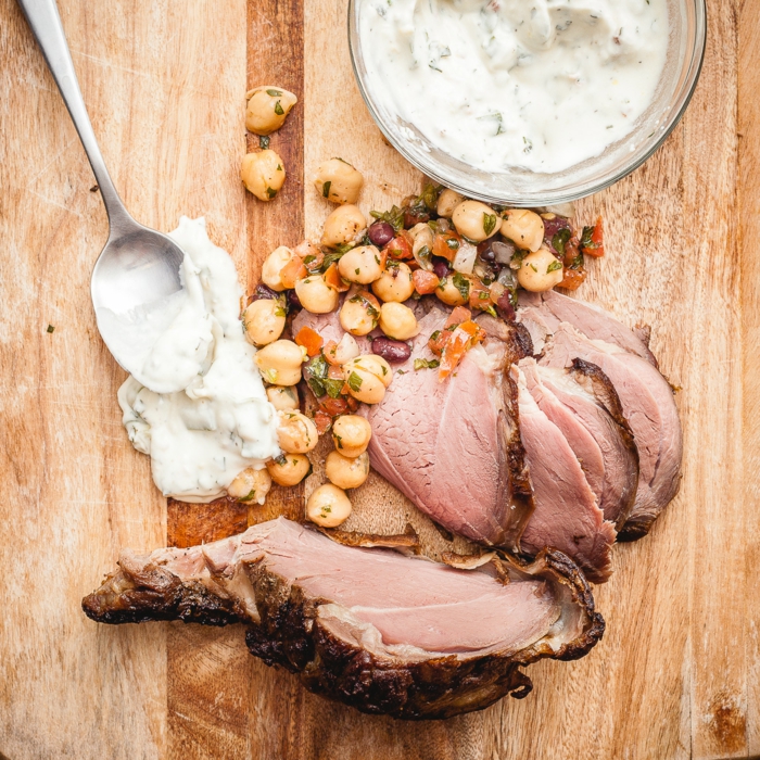 sliced ham on wooden surface, easter buffet 2019, bowl of yoghurt on the side, chickpeas salad