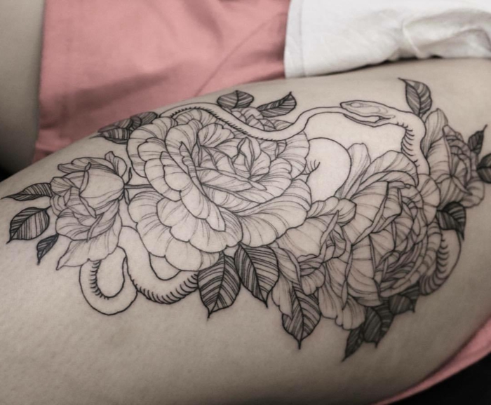 snake surrounded by peony flowers, what does ouroboros mean, thigh tattoo