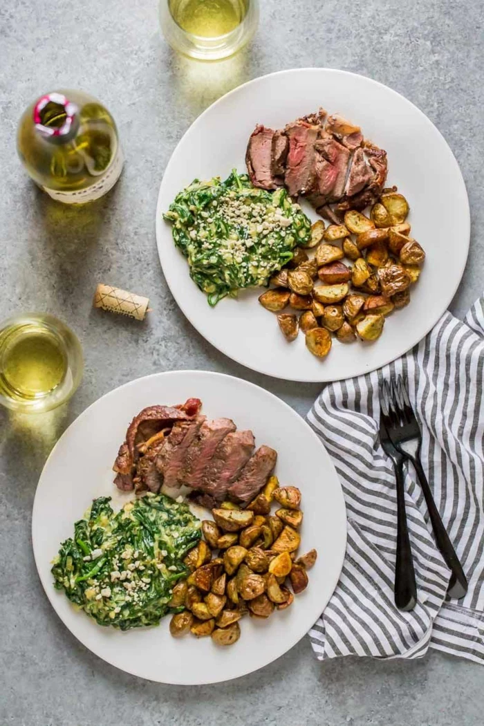 super quick dinner ideas, steak with roasted potatoes, creamy spinach salad on the side, white plates