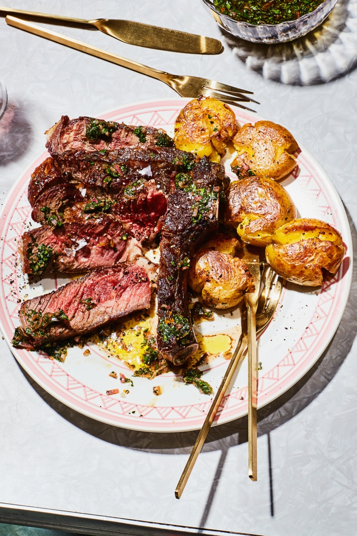 steak with roasted potatoes, super quick dinner ideas, white plate with brass fork and knife on the side