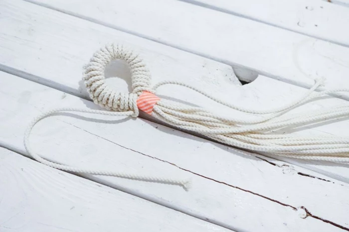 white macrame held together with tape, step by step diy tutorial for different knots, macrame plant hanger