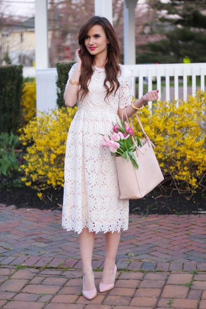 woman with long brown hair, wearing a white lace dress, womens easter dresses 2019, bouquet of tulips inside a leather bag