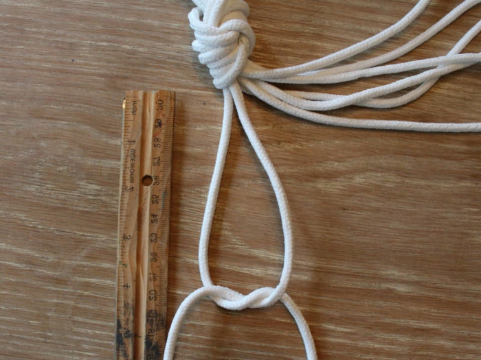 diy hanging planter, two different knots on white strands of macrame, step by step diy tutorial, wooden surface