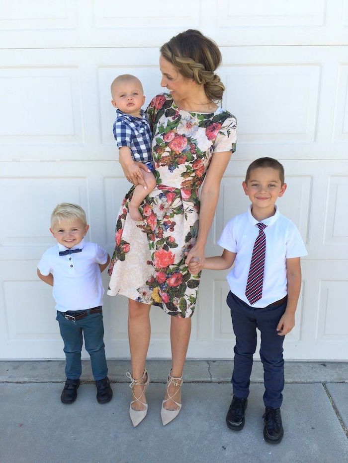 woman holding a baby, two boys next to her, wearing a white dress with floral print, cute easter outfits