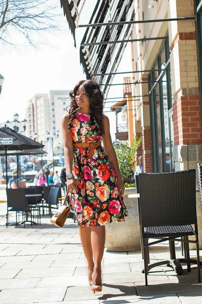 woman walking on a sidewalk, wearing a dress with floral print, cute easter outfits, nude heels