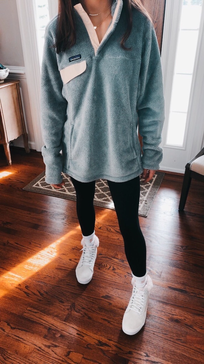 girl wearing black leggings, grey plush sweatshirt, cute lazy outfits, white sneakers, wooden floor