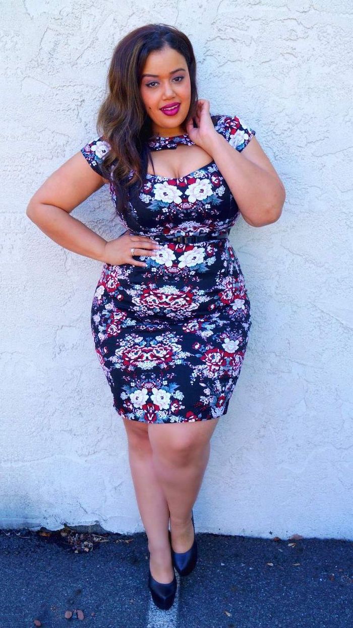 woman with brown wavy hair, wearing navy blue dress with floral print, cute spring dresses, black heels