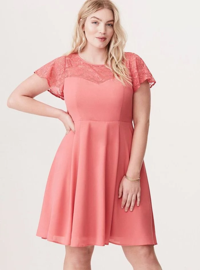 woman with blonde wavy hair, sunflower dress womens, wearing a pink dress with lace sleeves