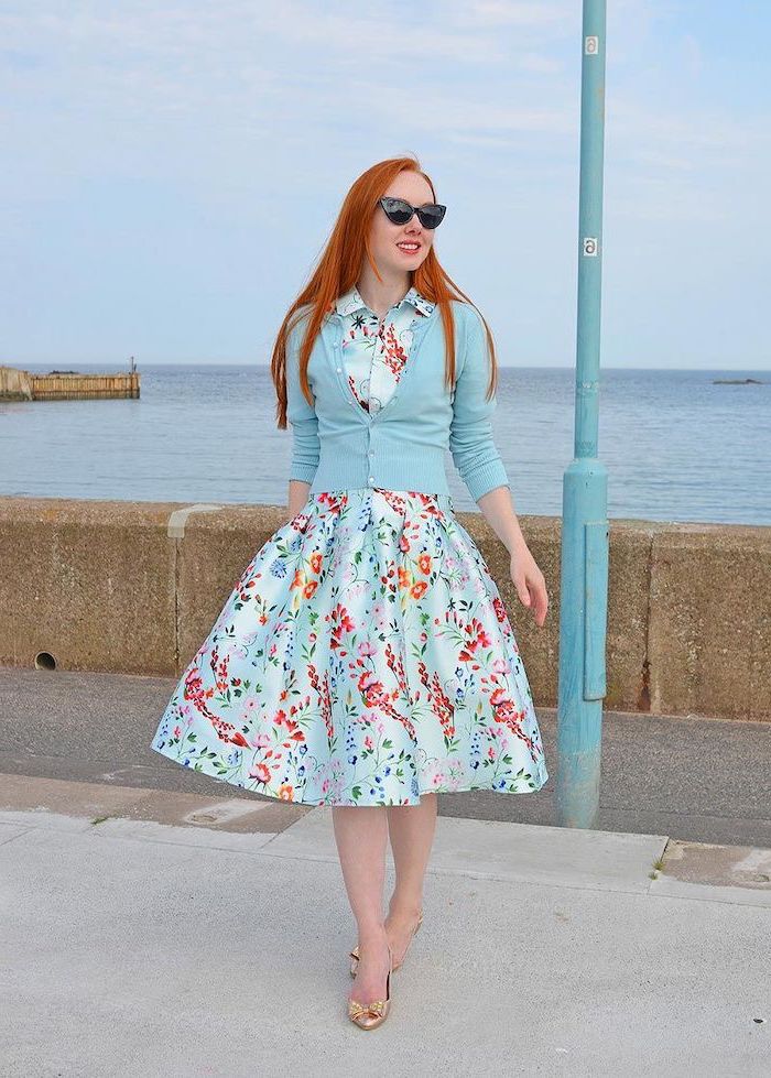 woman with long red hair, wearing blue dress with floral print, sunflower dress womens, blue cardigan
