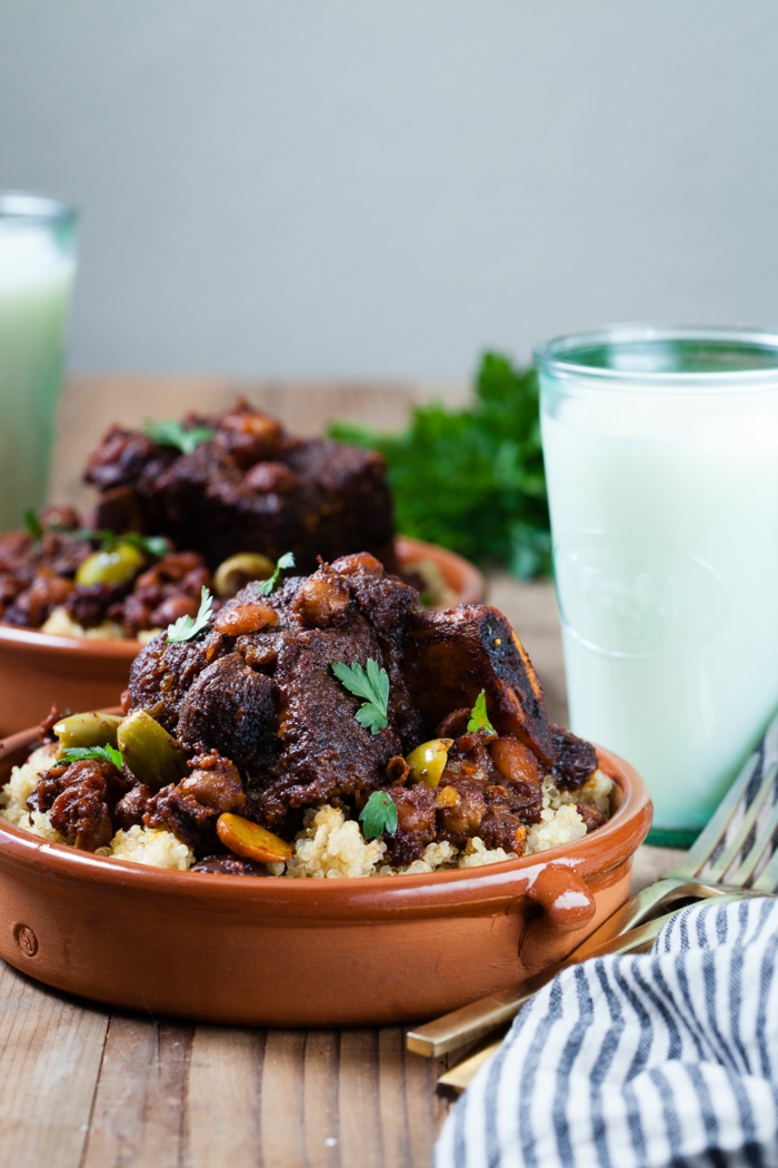 dinner ideas for two, braised short rib, placed in ceramic bowl with white rice, garnished with parsley