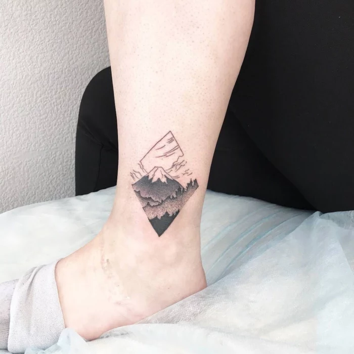 ankle tattoo, geometrical design, simple mountain tattoo, mountain with a snowy peak
