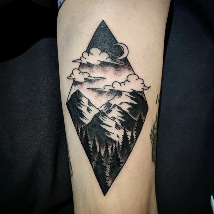 geometrical design, mountain landscape with forest, clouds and moon in the sky, mountain range tattoo, back of arm tattoo