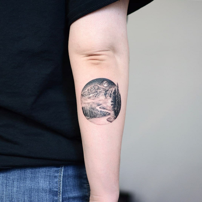 Showcase your adventurous spirit with a mountain range tattoo