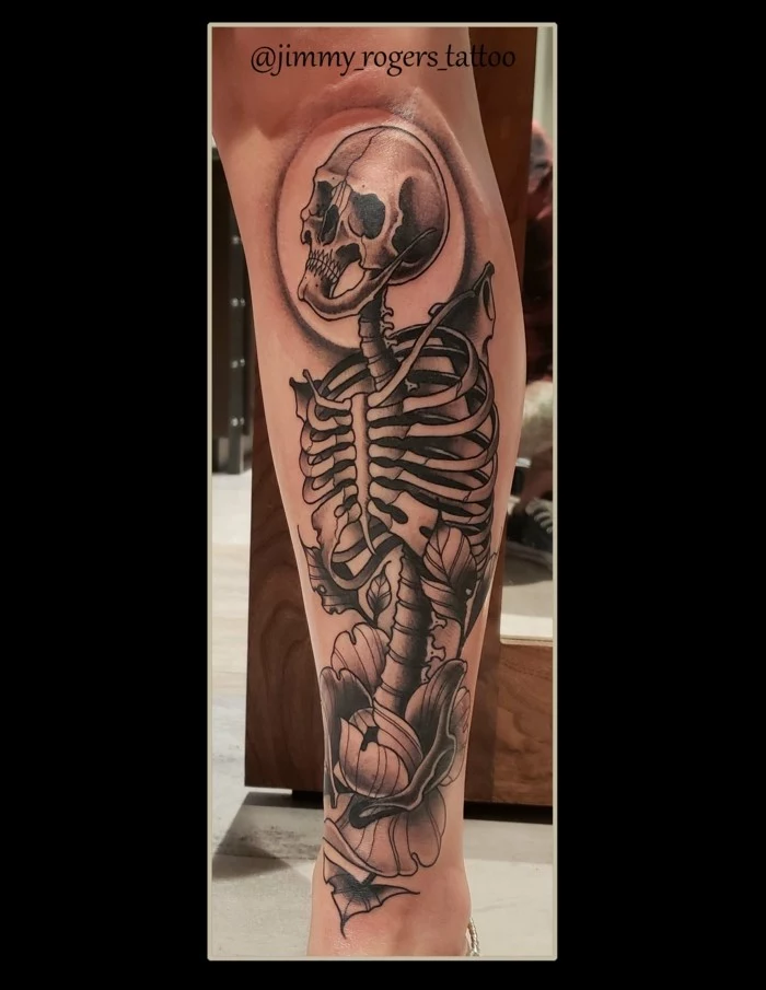 leg tattoo, traditional style tattoos, black and grey skull tattoo