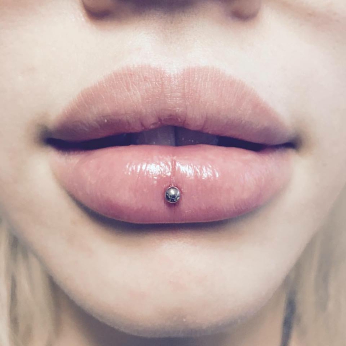 close up photo, lips with clear lip gloss, labret piercing