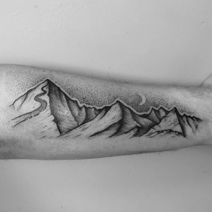 forearm tattoo, simple mountain tattoo, mountain range with a ski slope, black and white photo