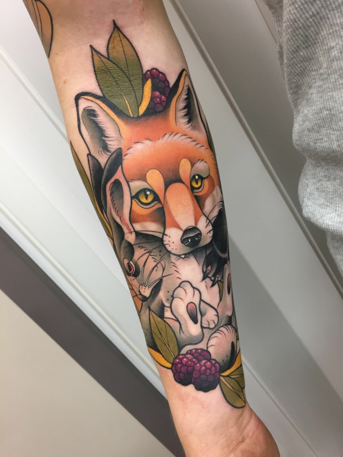 fox and a rabbit, blackberries and leaves around them, forearm tattoo, neo traditional tattoo