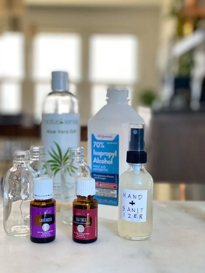 bottle of alcohol and aloe vera gel, diy hand sanitizer, tea tree and lavender essential oil