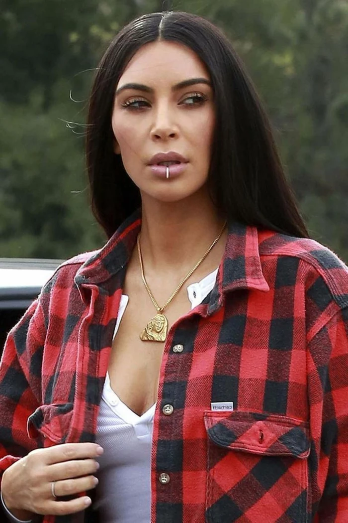 kim kardashian, wearing red plaid shirt and white top, types of lip piercings, golden necklace