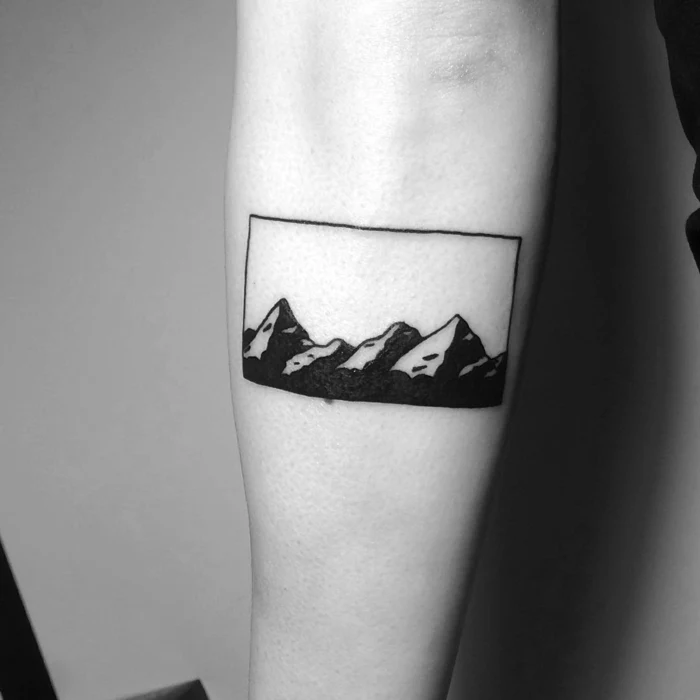 black and white photo, mountain tattoo sleeve, simple mountain range, forearm tattoo