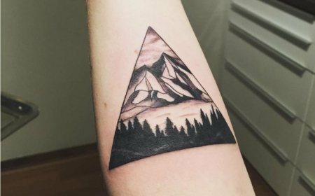 Showcase your adventurous spirit with a mountain range tattoo