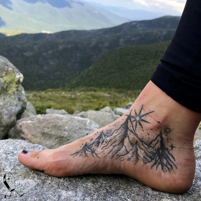 inside the foot tattoo, mountain tattoo ideas, mountain range surrounded by stars